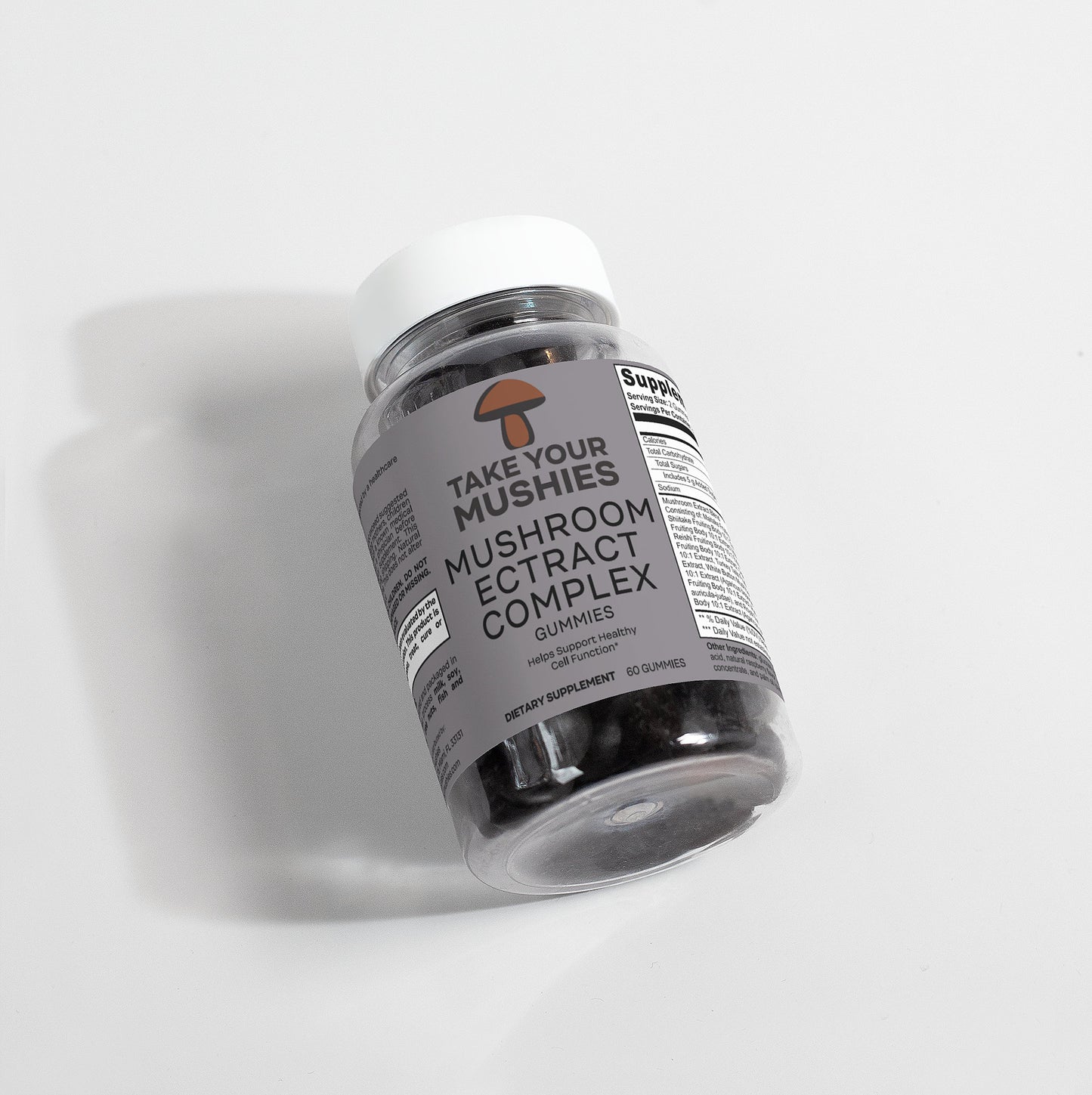 Bottle of 'Take Your Mushies' mushroom extract complex gummies on a white background