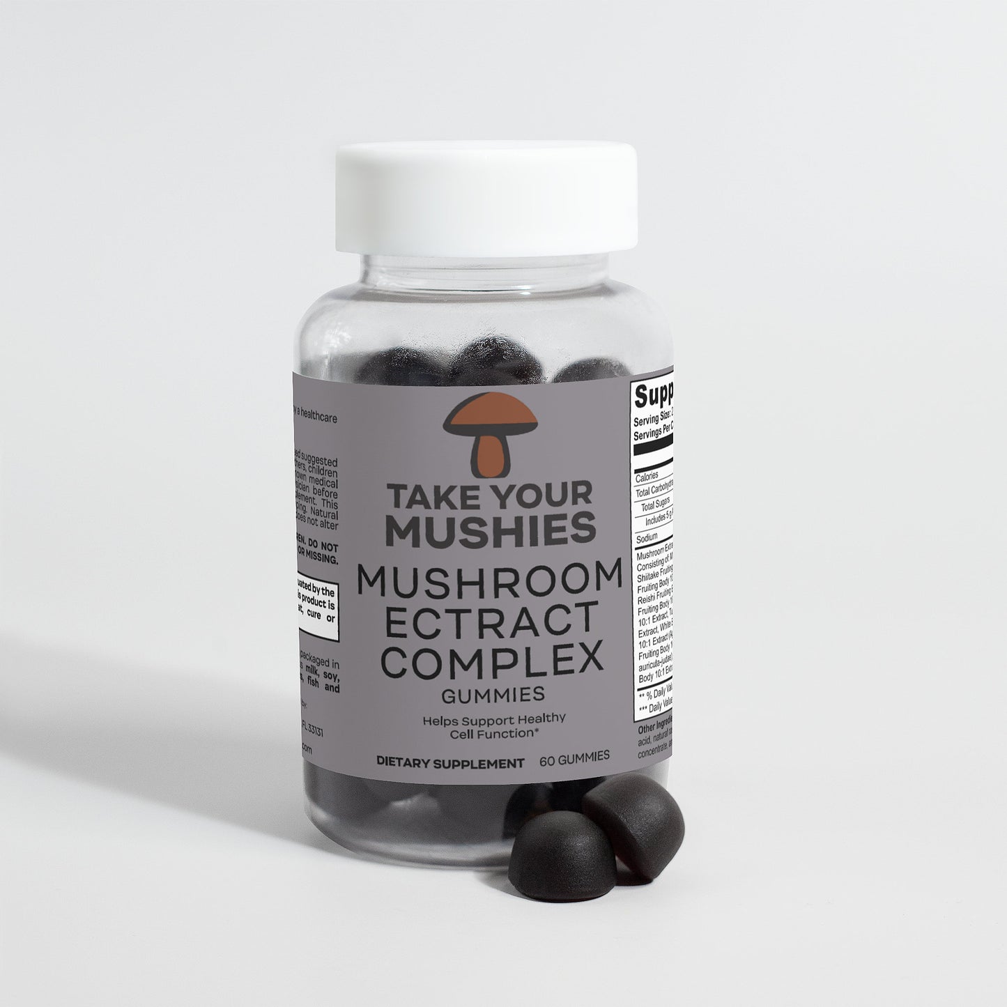 Bottle of 'Take Your Mushies' mushroom extract complex gummies on a light gray background