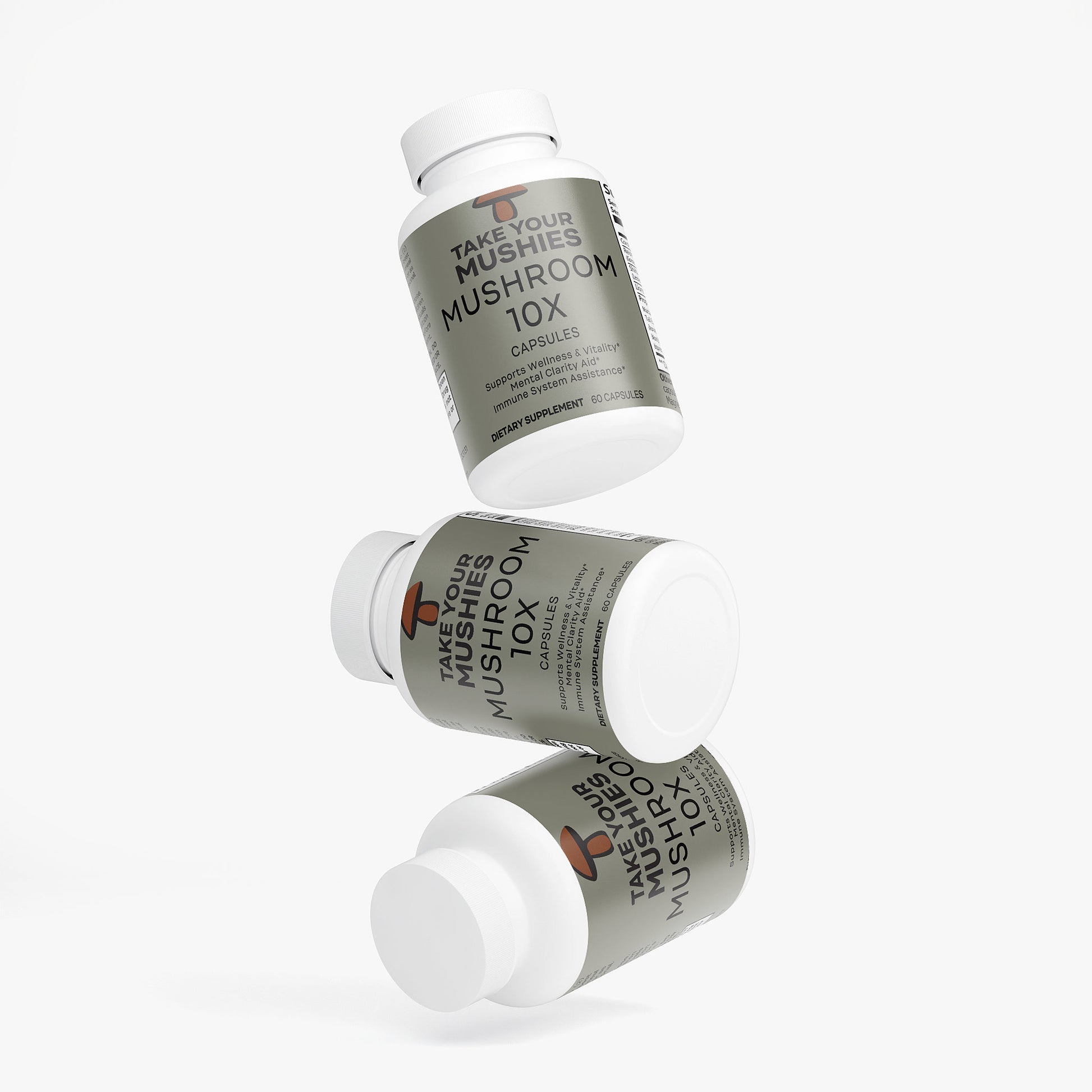Three bottles of 'Take Your Mushrooms' Mushroom 10X capsules on a white background